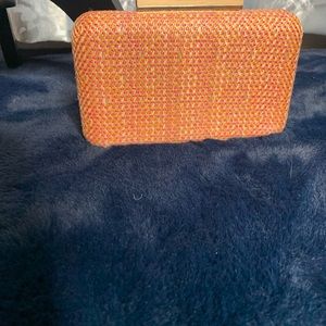 NWT clutch canvas/linen feel coral and tan in color